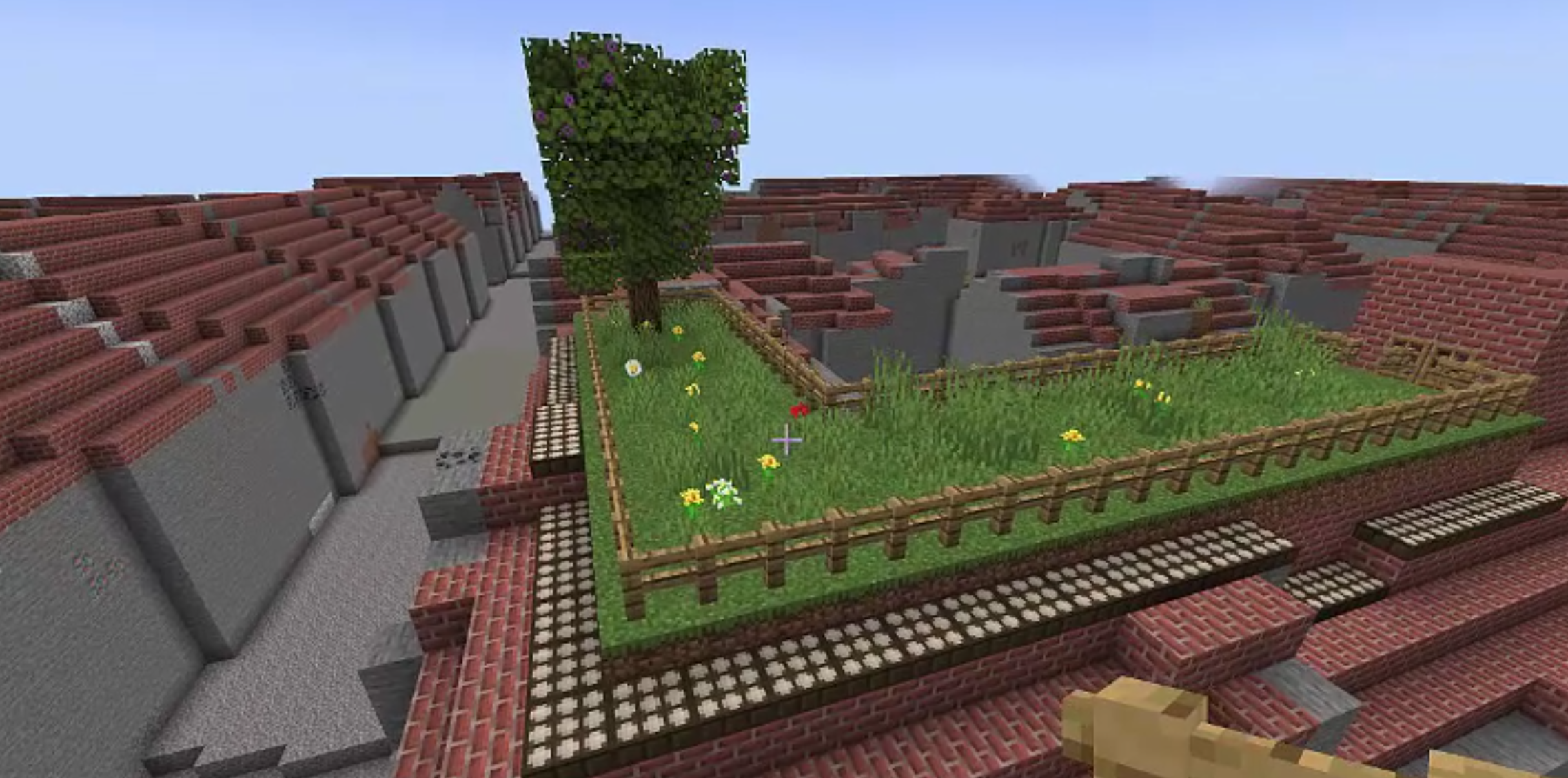 Begrünte Dachflächen eines in Minecraft abgebildeten Gebäudes in der Nähe der Münchener Implerstraße.  Das Modell wurde auf der Grundlage von Daten des digitalen Zwillings von einer Schülergruppe des Münchener Dante Gymnasiums entworfen.